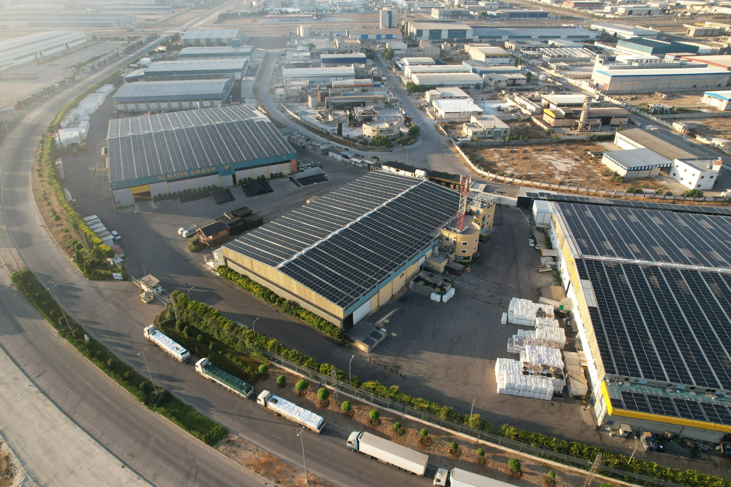 KFP industrial photovoltaic installation across large industrial roofs; representative PV project image