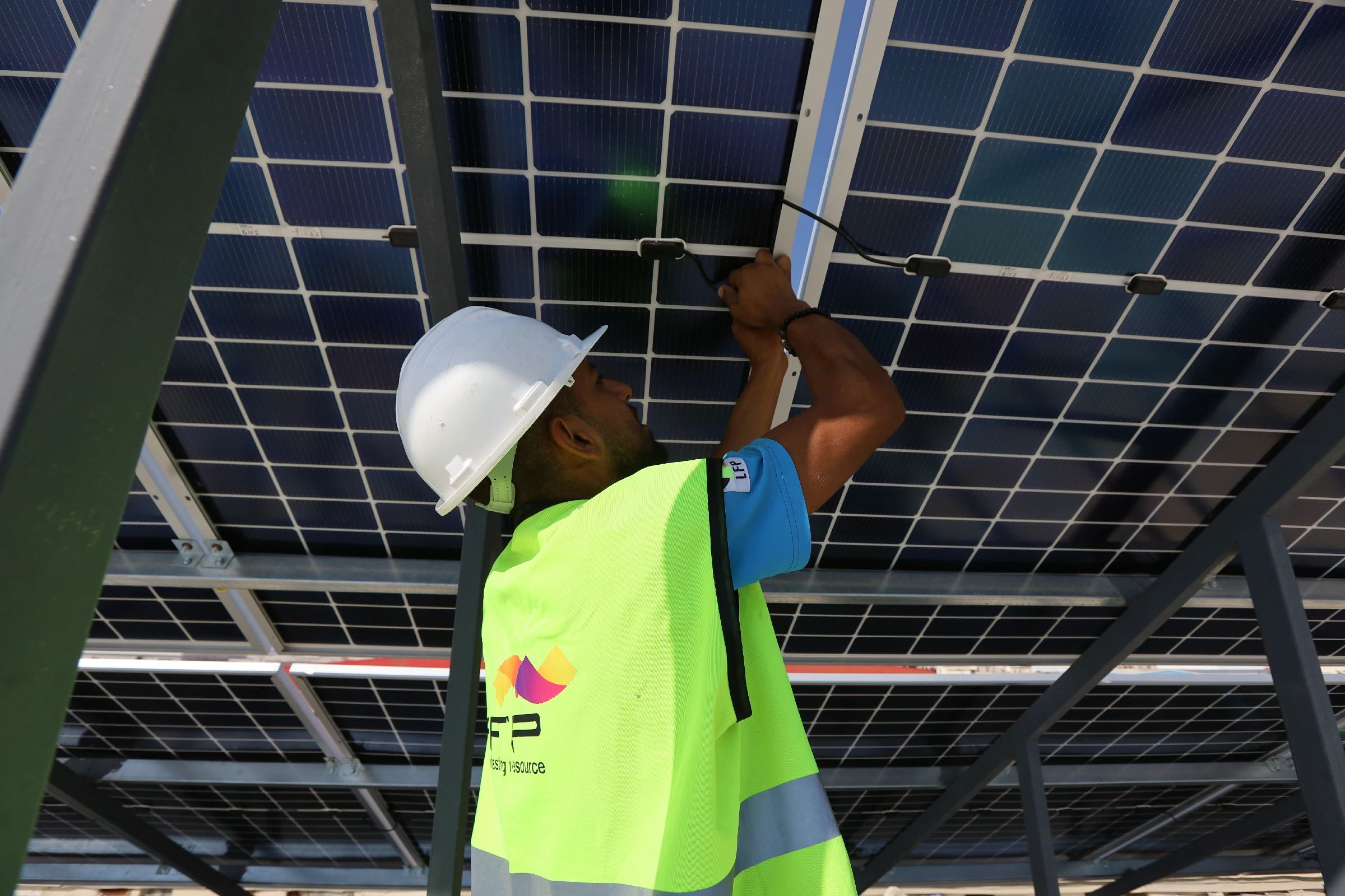Engineers reviewing technical documentation during a solar site audit